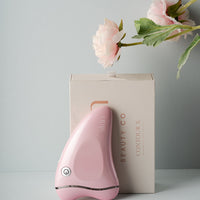 Gua sha face massaging and sculpting device. styled image - skiin beauty co